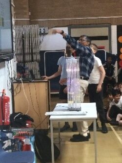 Hari demonstrating the ion implantation setup 